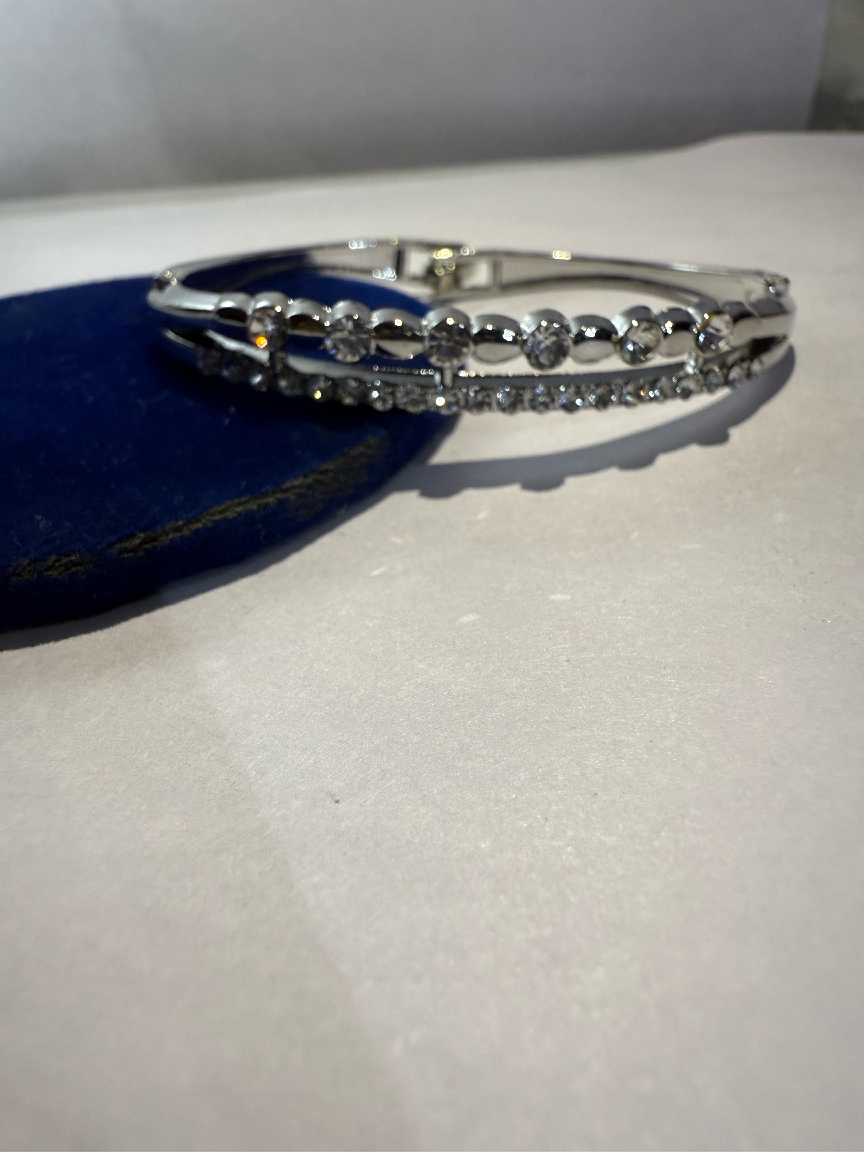 Elegant Silver Bangle with Clear Stones
