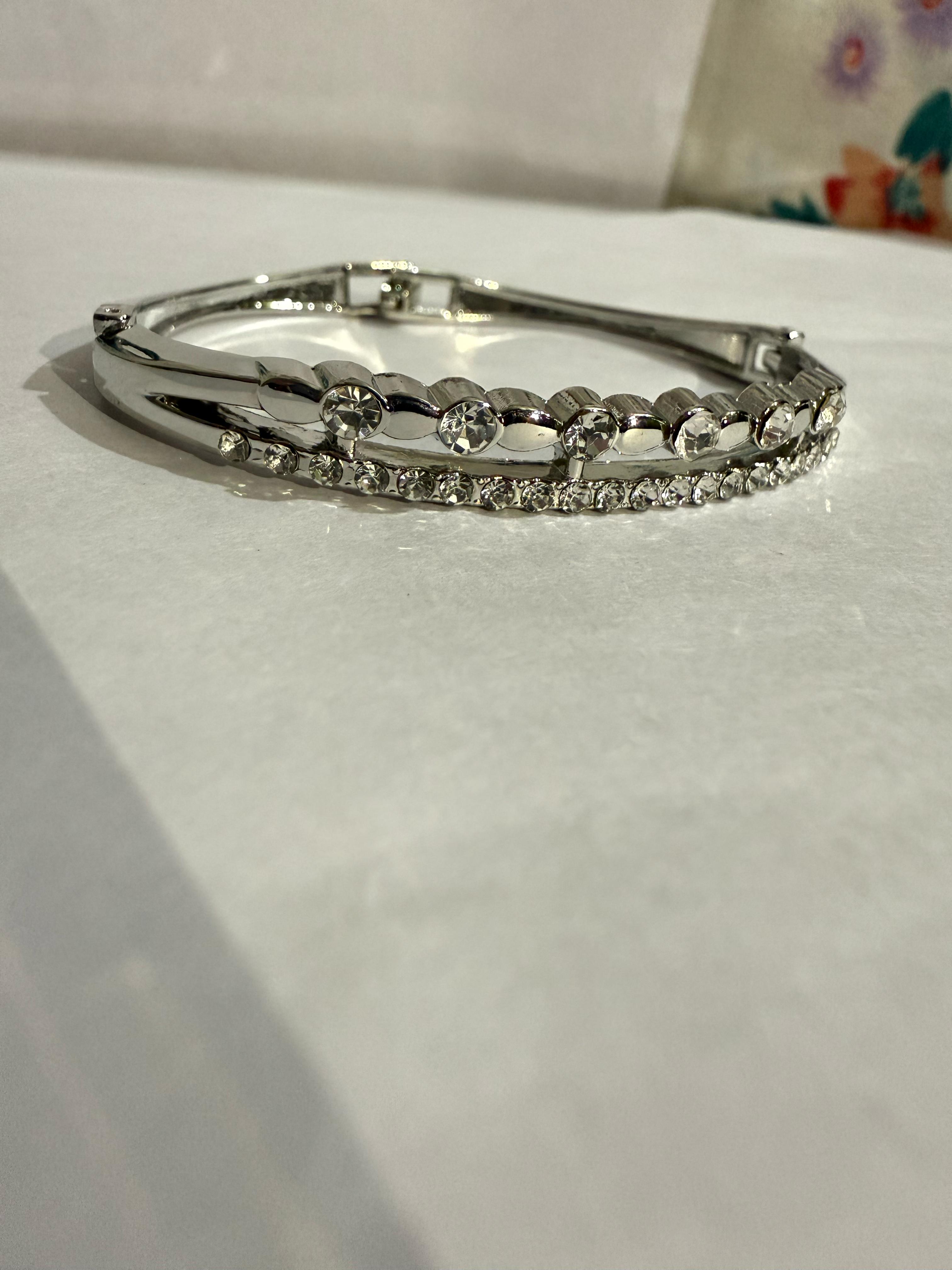 Elegant Silver Bangle with Clear Stones