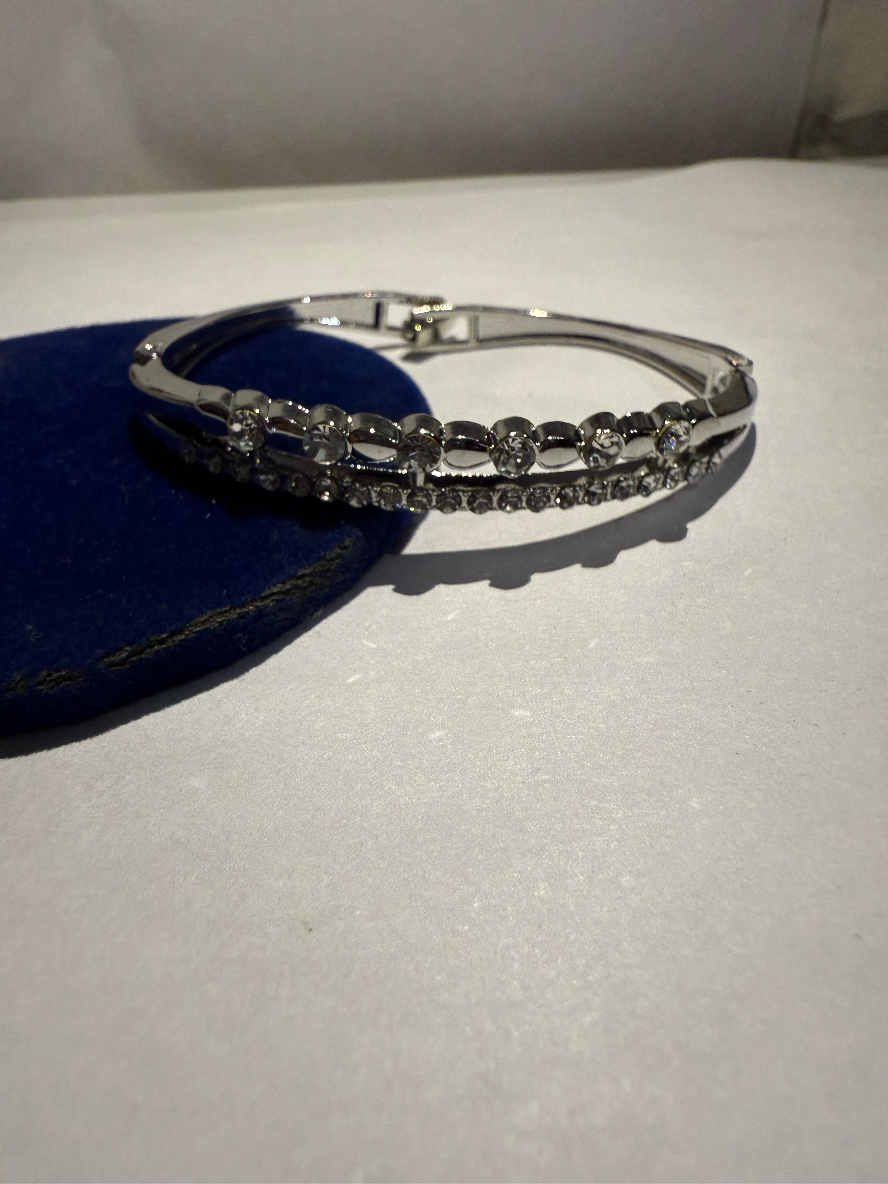 Elegant Silver Bangle with Clear Stones