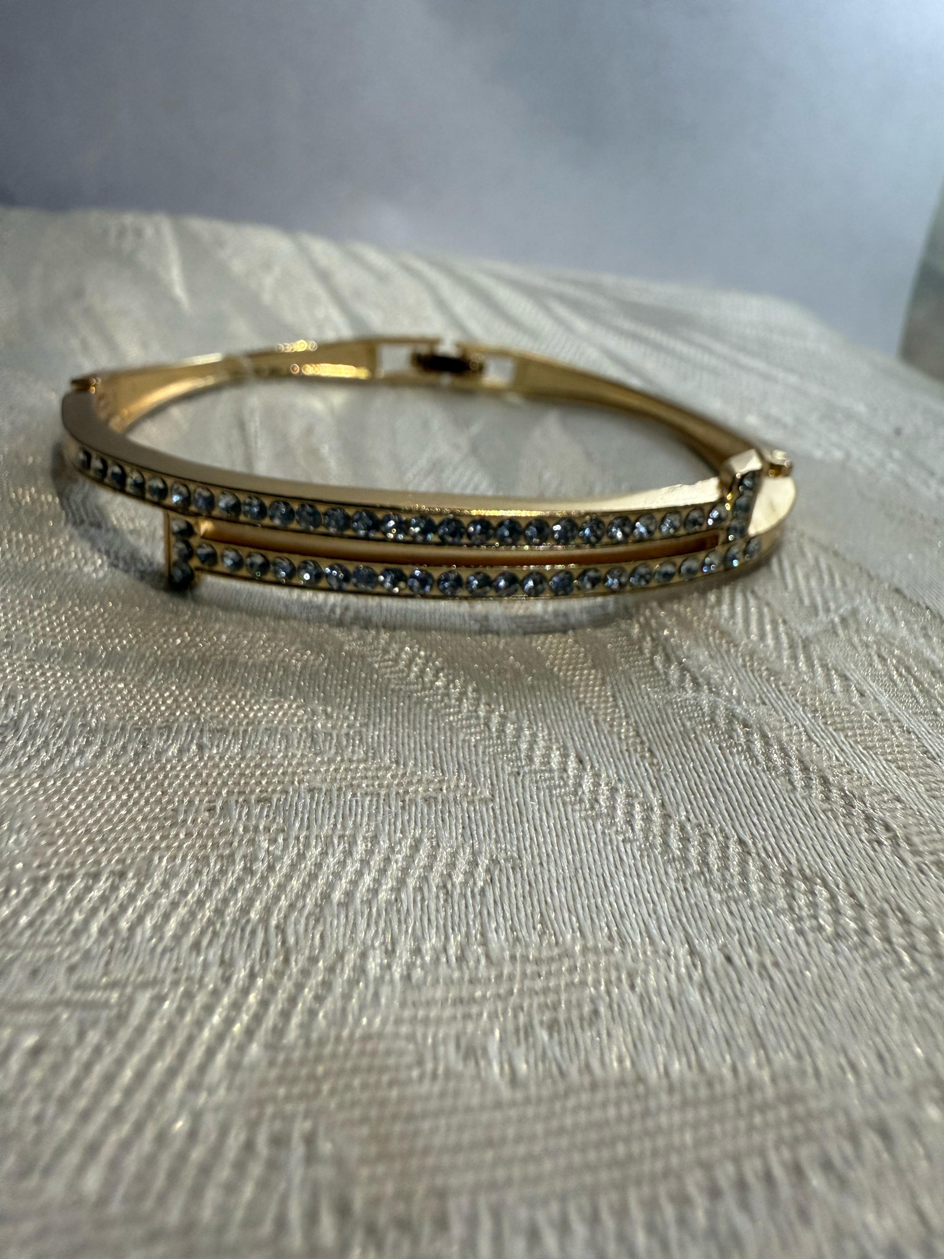 Stunning Gold-Toned Artificial Cuff Bracelet with Sparkling Rhinestones.