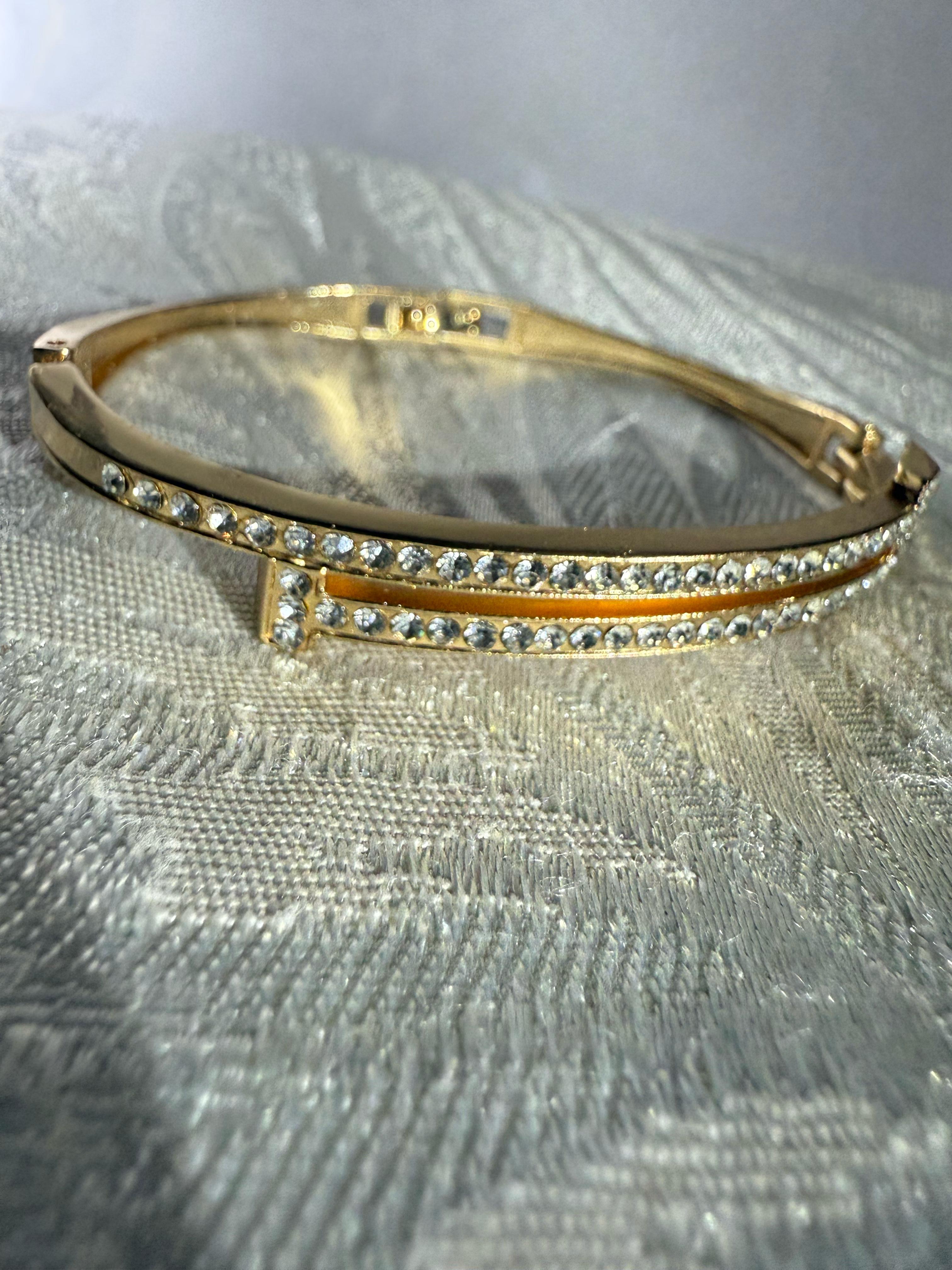 Stunning Gold-Toned Artificial Cuff Bracelet with Sparkling Rhinestones.