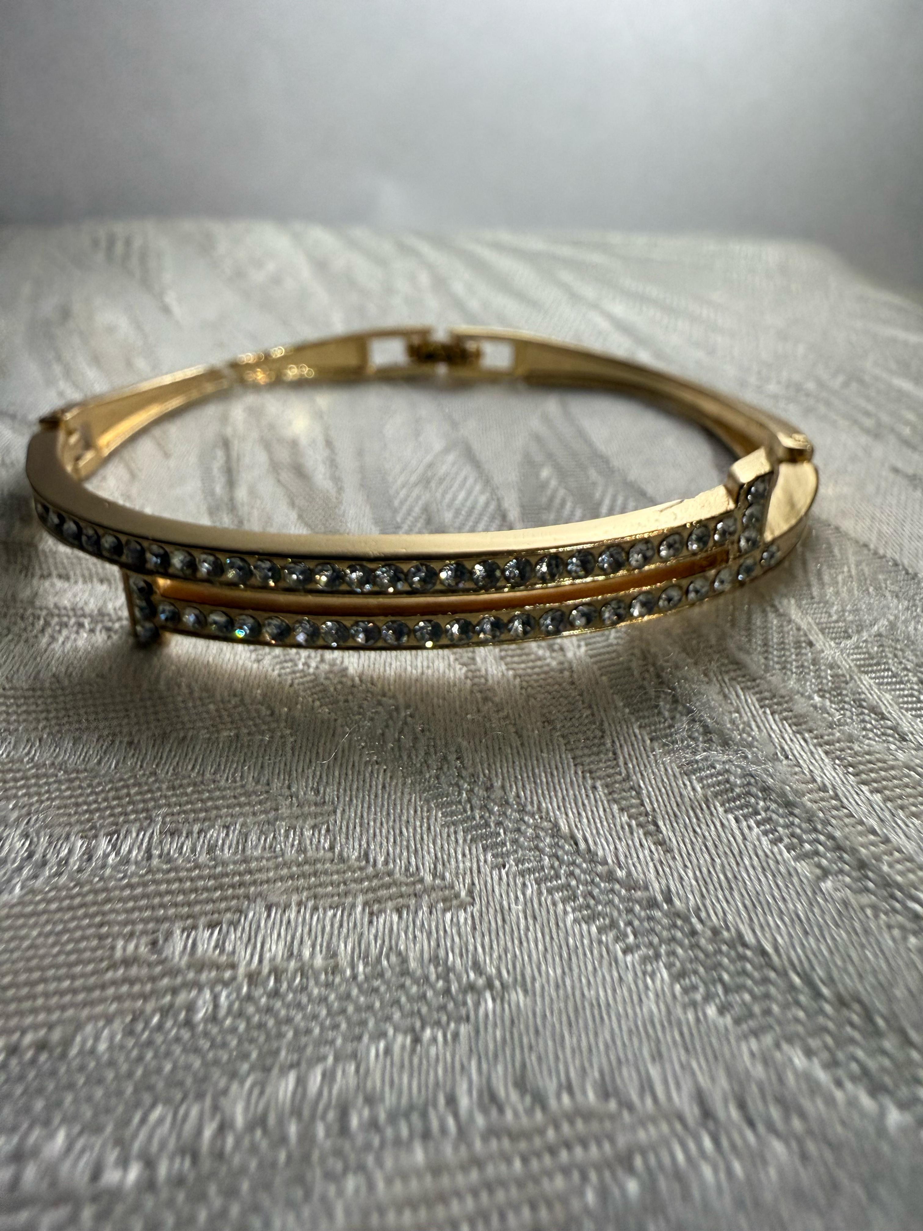 Stunning Gold-Toned Artificial Cuff Bracelet with Sparkling Rhinestones.