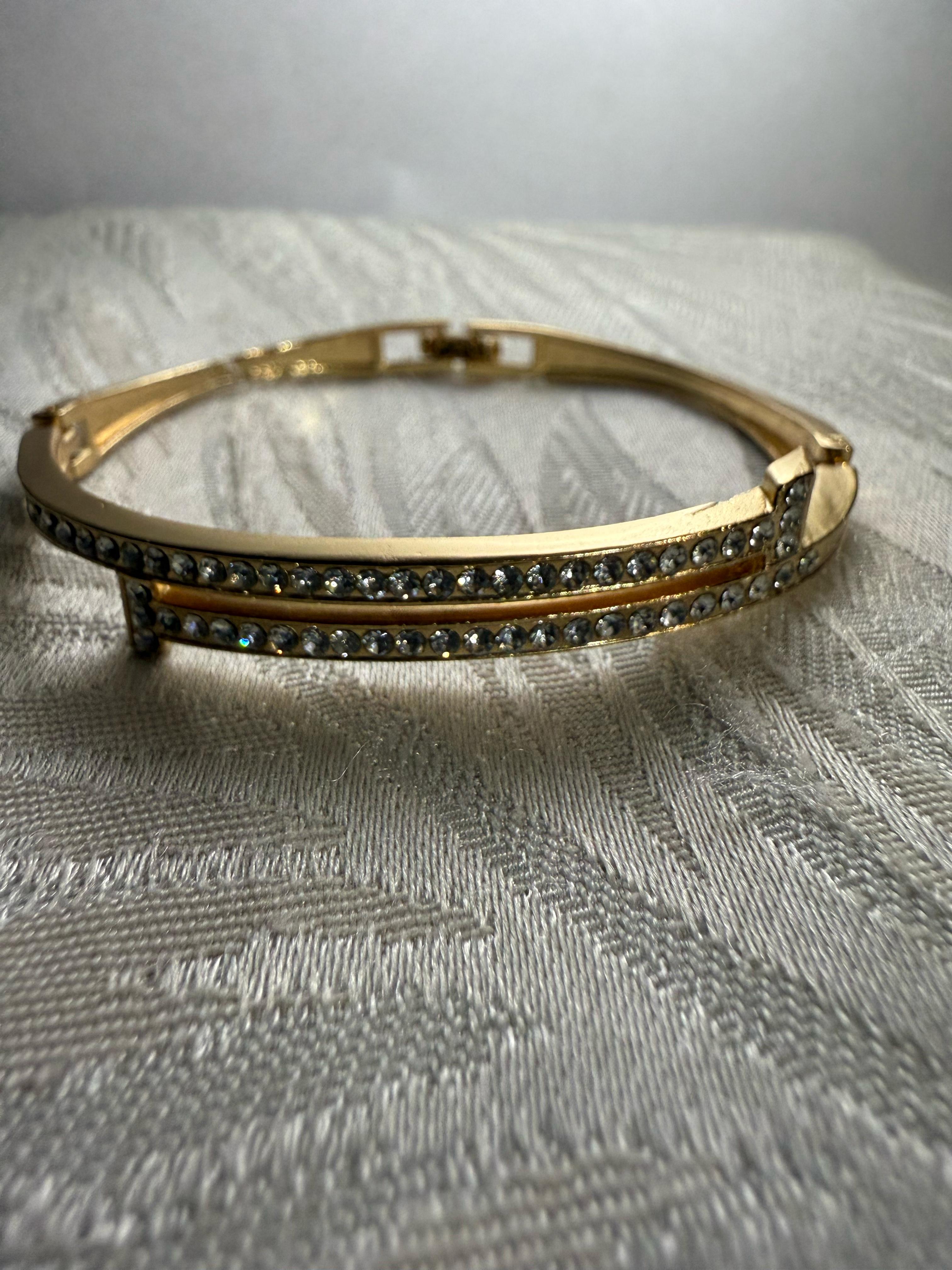 Stunning Gold-Toned Artificial Cuff Bracelet with Sparkling Rhinestones.