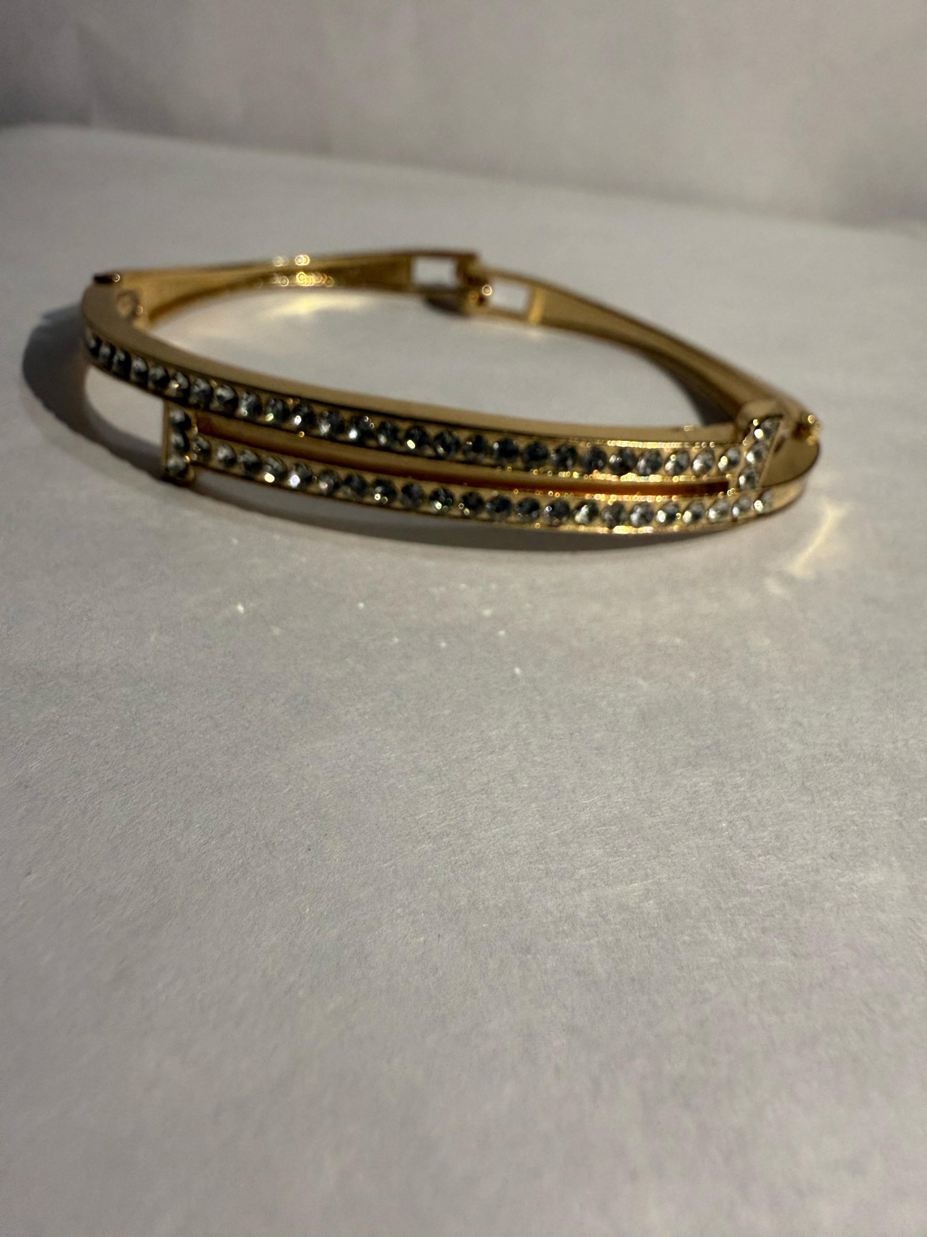 Stunning Gold-Toned Artificial Cuff Bracelet with Sparkling Rhinestones.