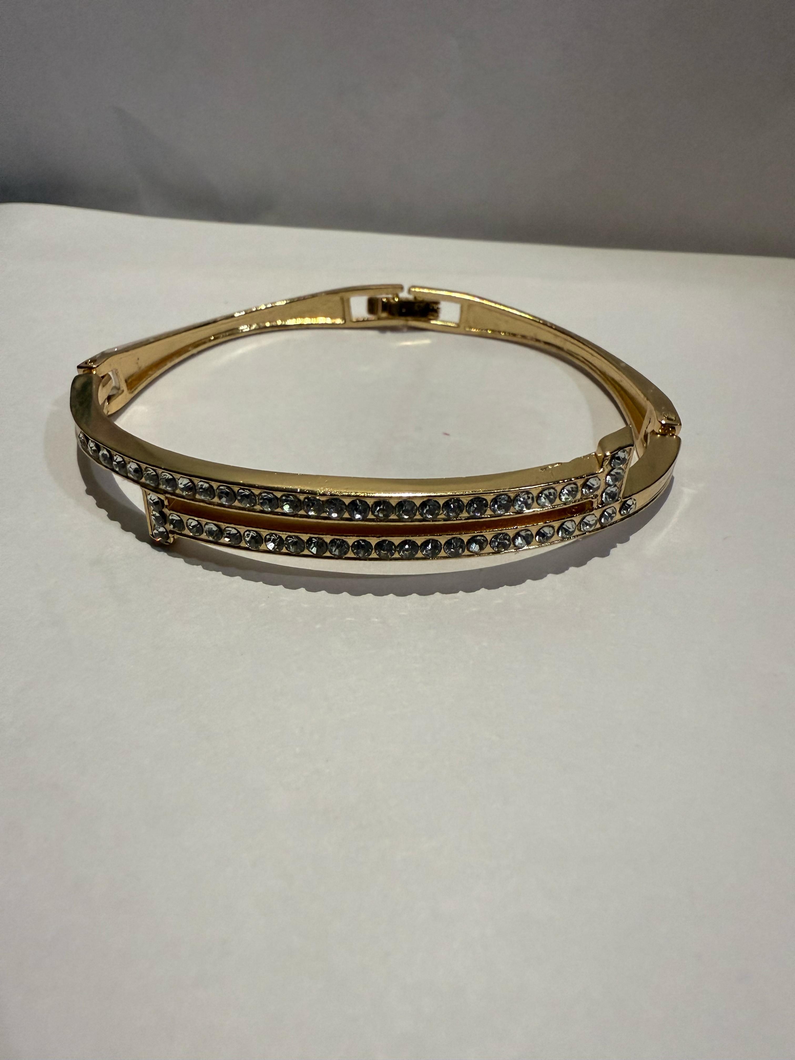 Stunning Gold-Toned Artificial Cuff Bracelet with Sparkling Rhinestones.